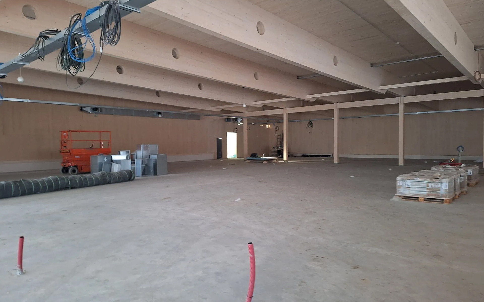 Glulam roof beams for a timber supermarket interior